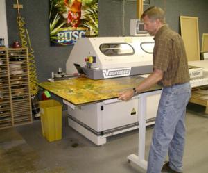 Print being edged as part of the Gallery Mount process Print being edged as part of the Gallery Mount process